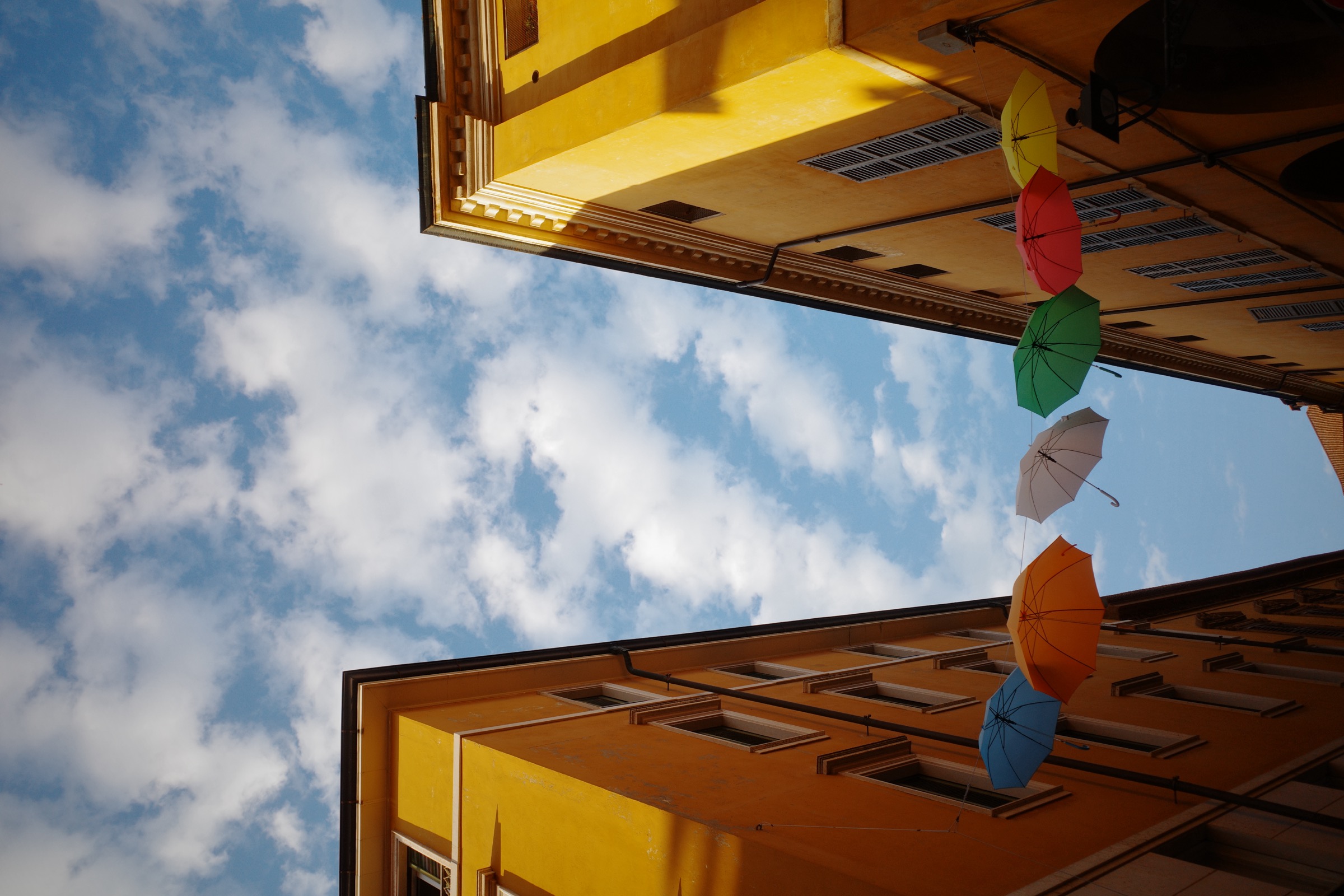 Italy — umbrella-strung street, Milan