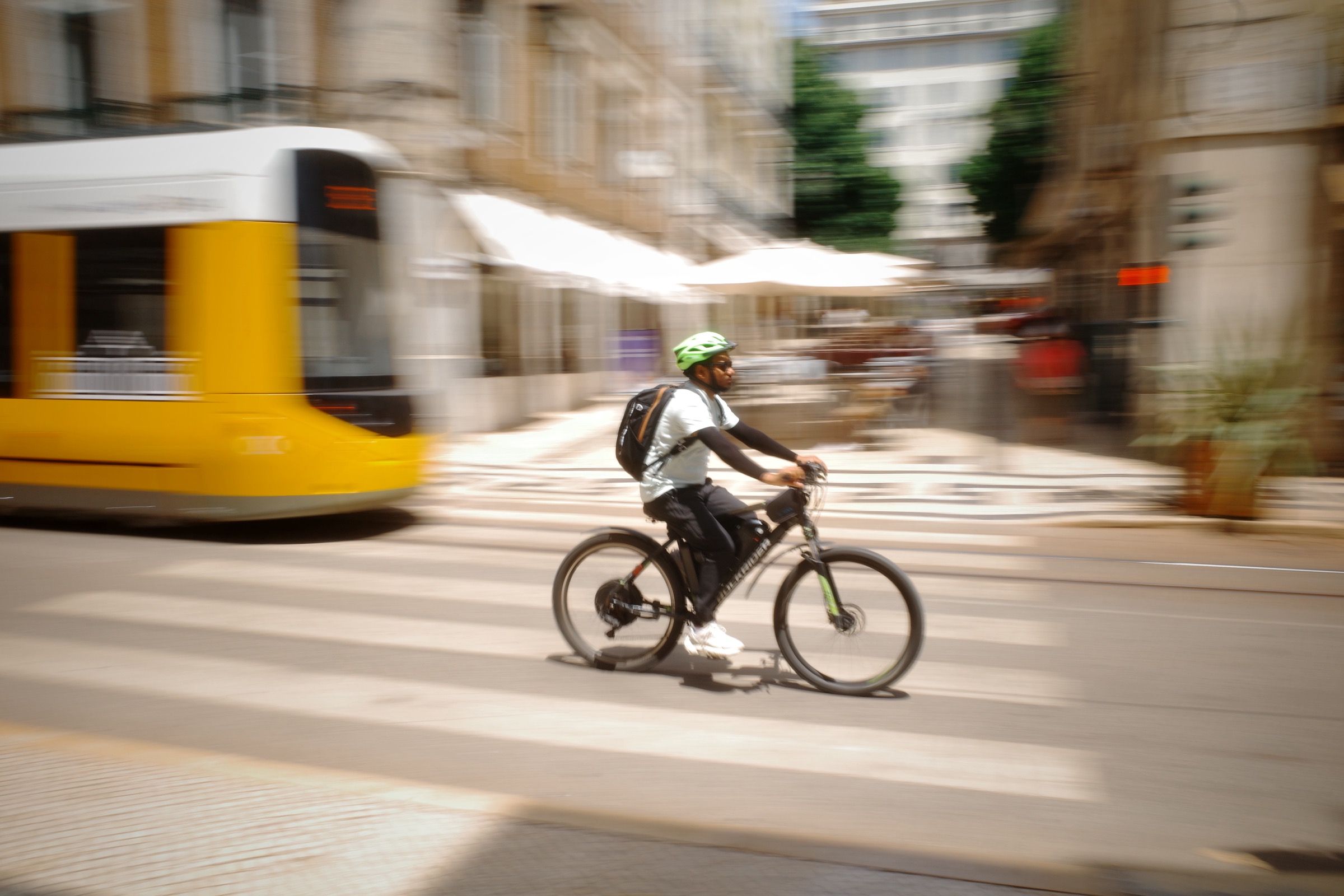 Portugal — cyclist and tram, Lisbon
